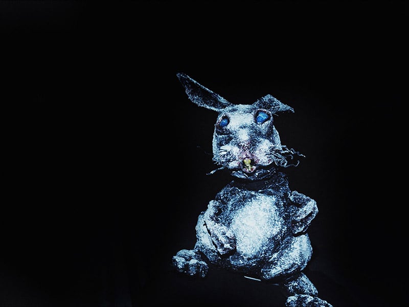 Graphic of built blue rat on black background